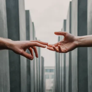 Two hands reaching out to one another